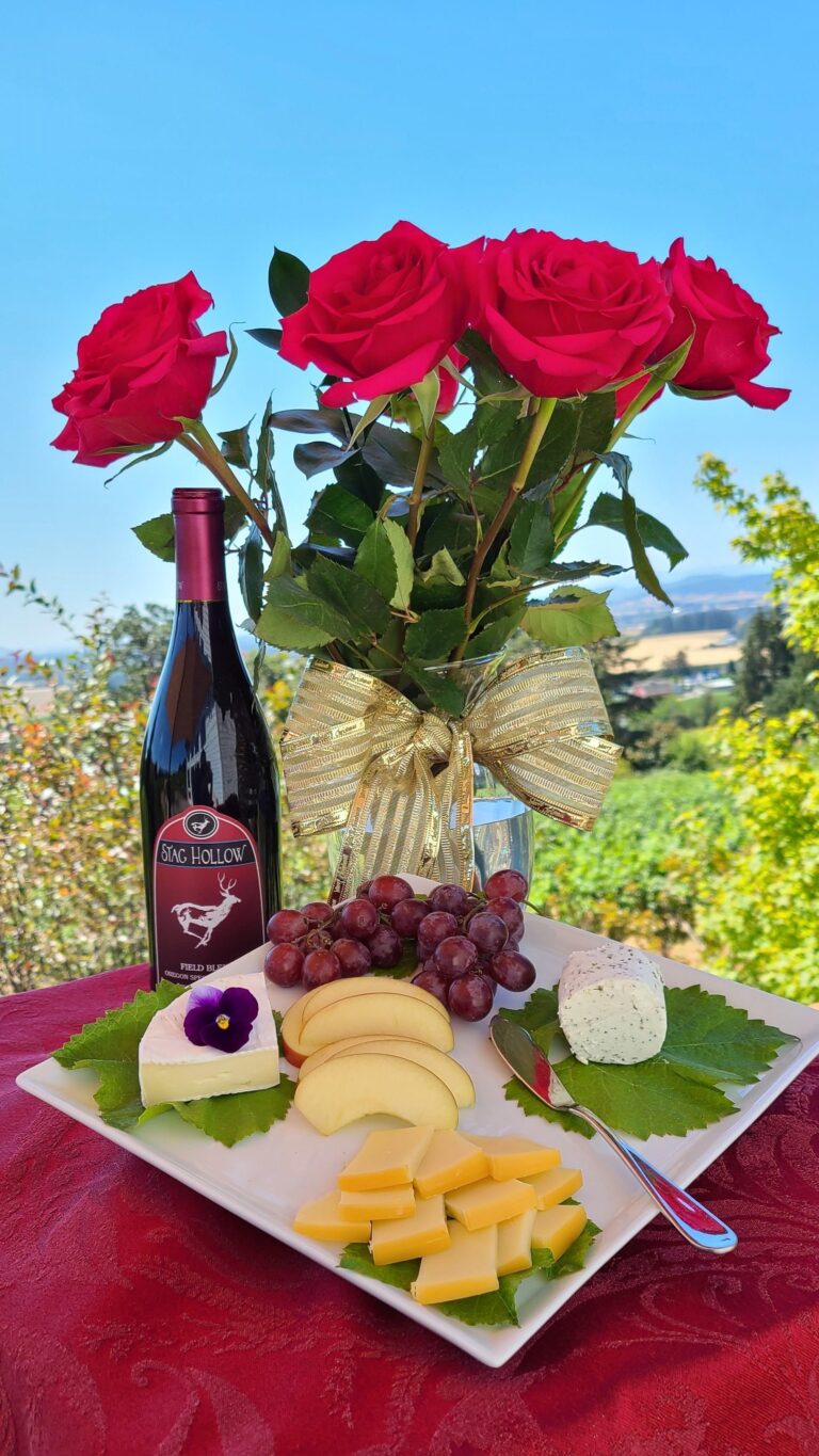 8 red roses, cheese, fruit, bottle of wine